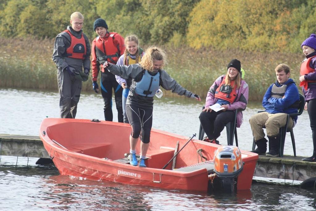 Leeds Fresher’s team watch on as Lucy attempts the gunwale walk – Photo by James Saul © James Saul